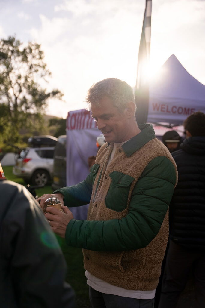 Nick Broadbent (tailfin CEO) pouring whisky at Tailfin Detours