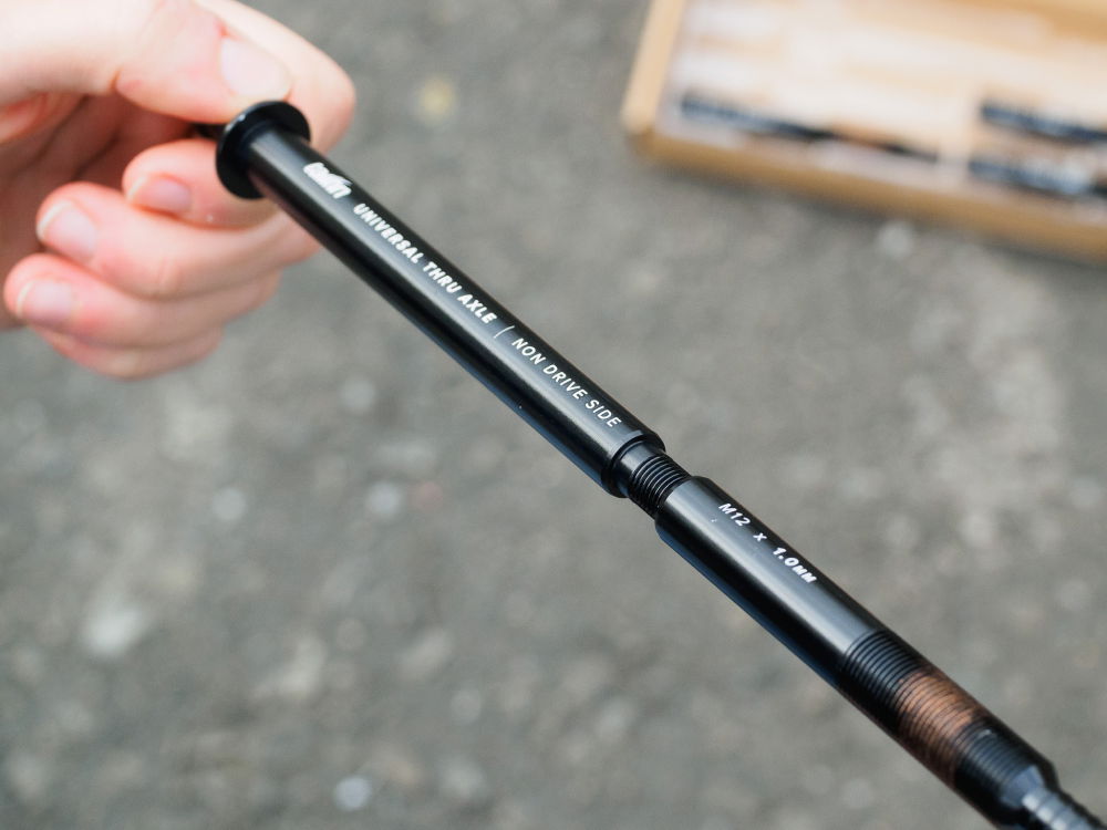 tailfin Universal Thru Axle being threaded together