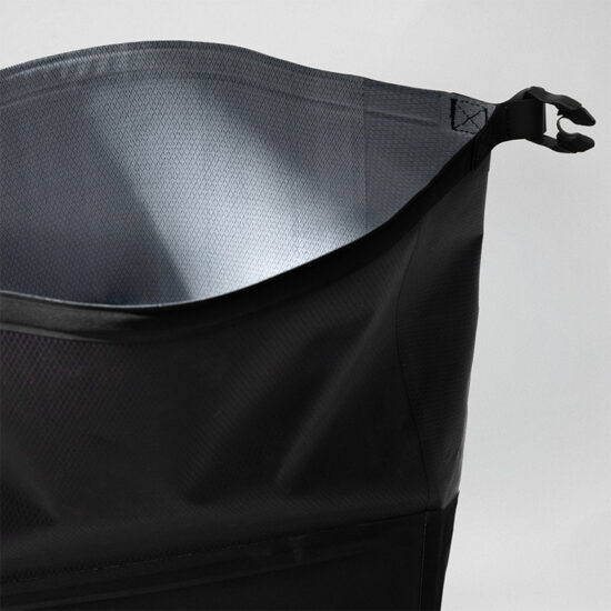 Tailfin black waterproof dry bag featuring a silver interior lining and buckle closure.