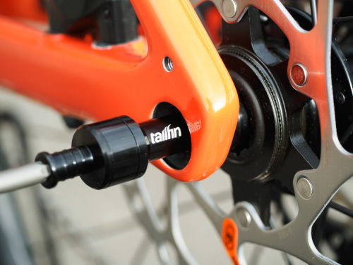 Insert the Tailfin Universal Thru Axle 