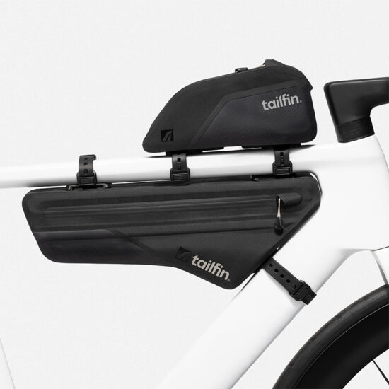 Tailfin bikepacking frame bags and top tube bag on a white Canyon bike.