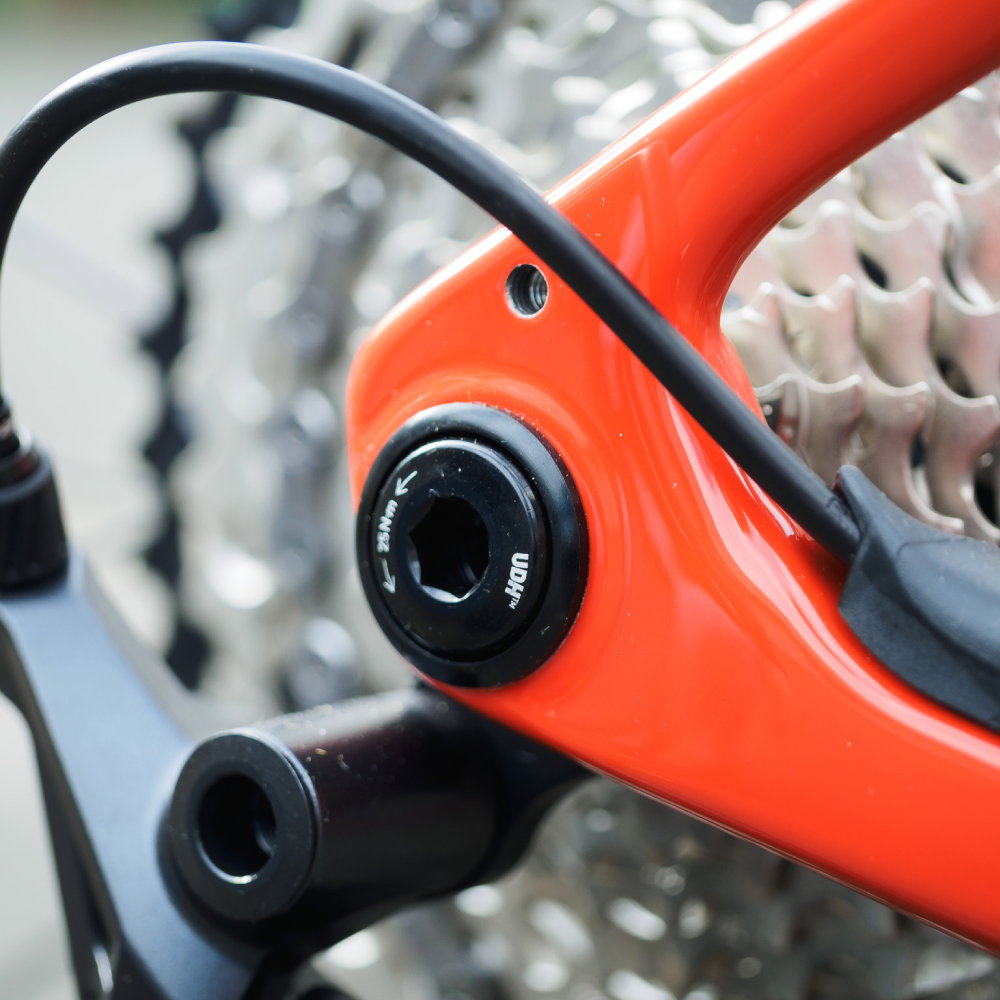 A close up image of a red bike featuring a SRAM UDH