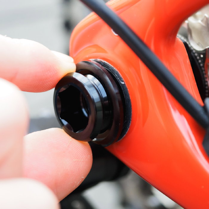Close-up of a red bike fitted with a Tailfin UDH Adaptor