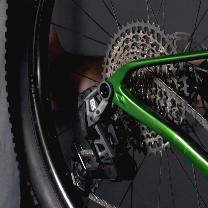 Mountain bike rear derailleur and axle to help choose a Tailfin adaptor.