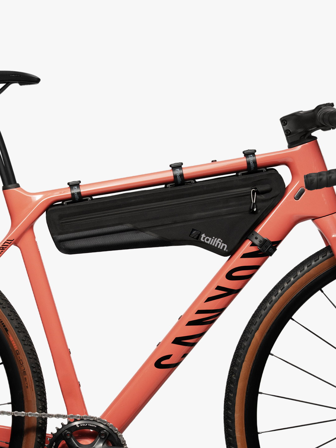 Tailfin gravel bike frame bag mounted on a coral Canyon bicycle.