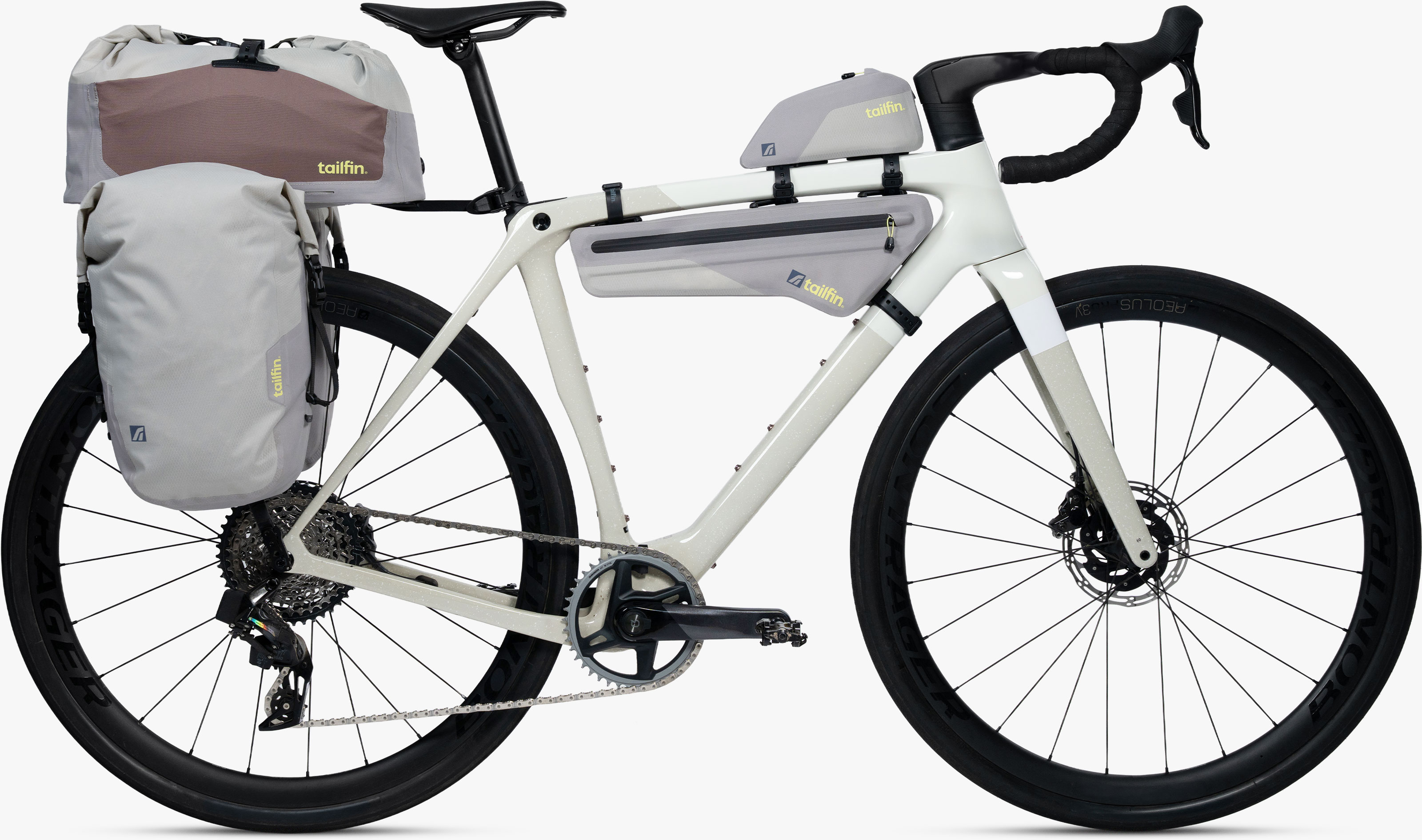 Tailfin bikepacking bags and rack setup on a modern off-white gravel bike.