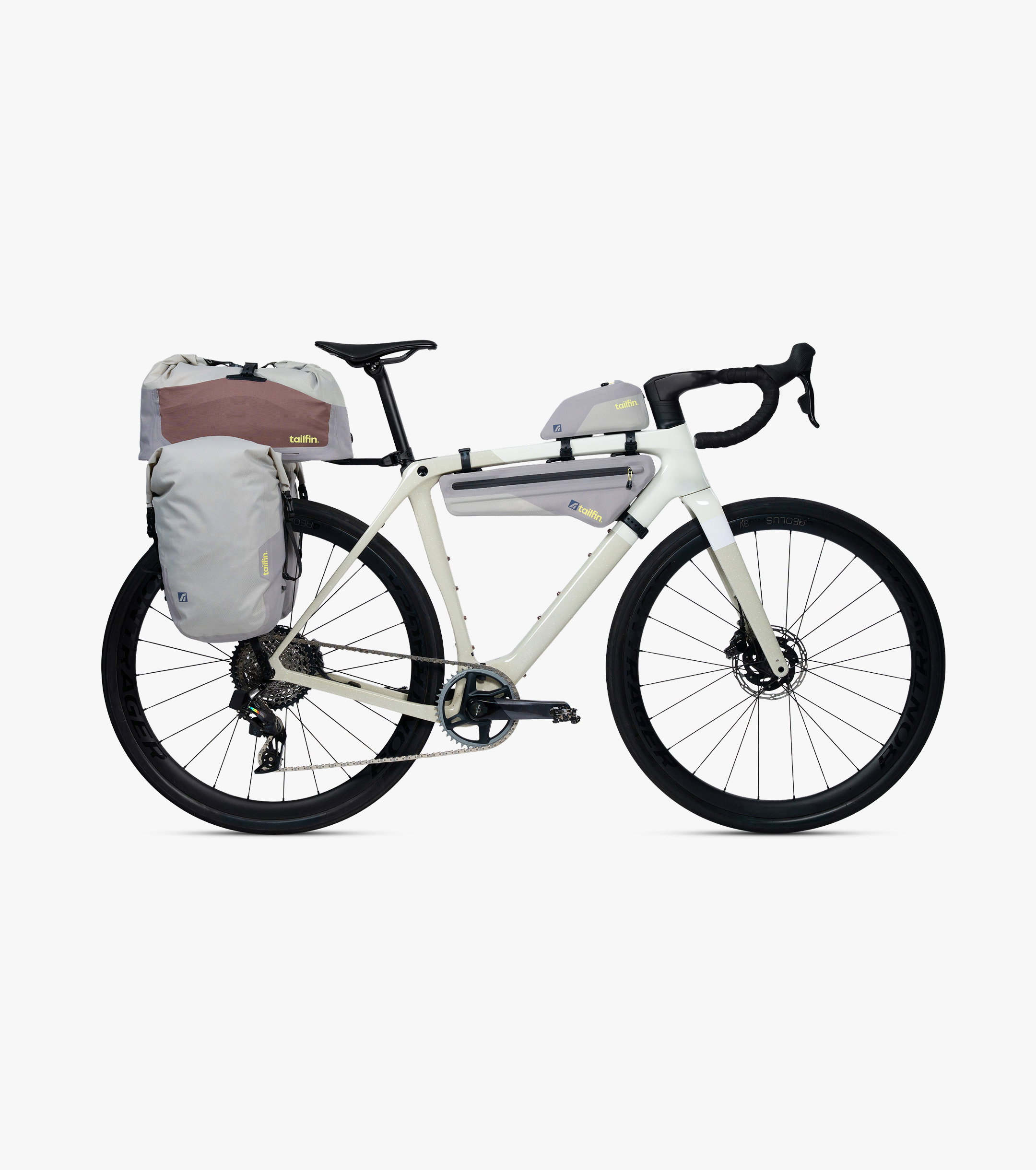 Modern gravel bike fitted with a complete Tailfin bikepacking bag and rack system.